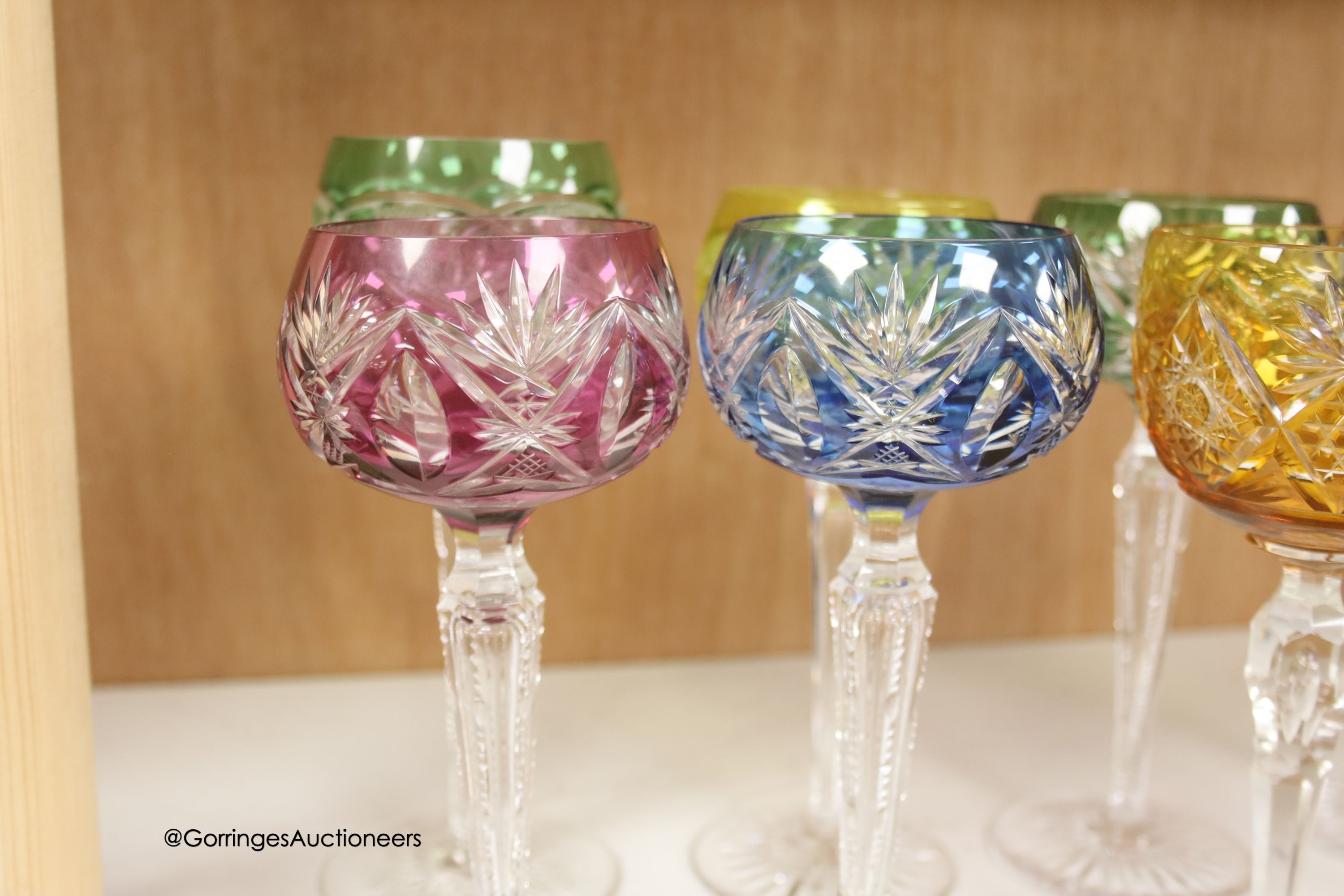 A harlequin collection of flash cut hock glasses, 19th century and later, tallest 21cm